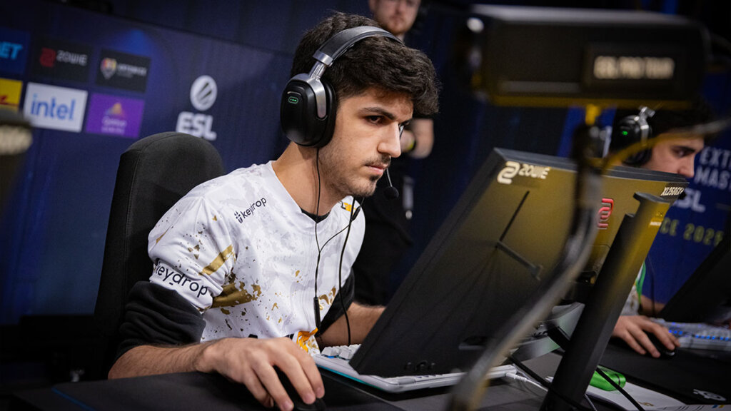 Esports player intensely focused on a gaming monitor during a Counter-Strike match at ESL tournament