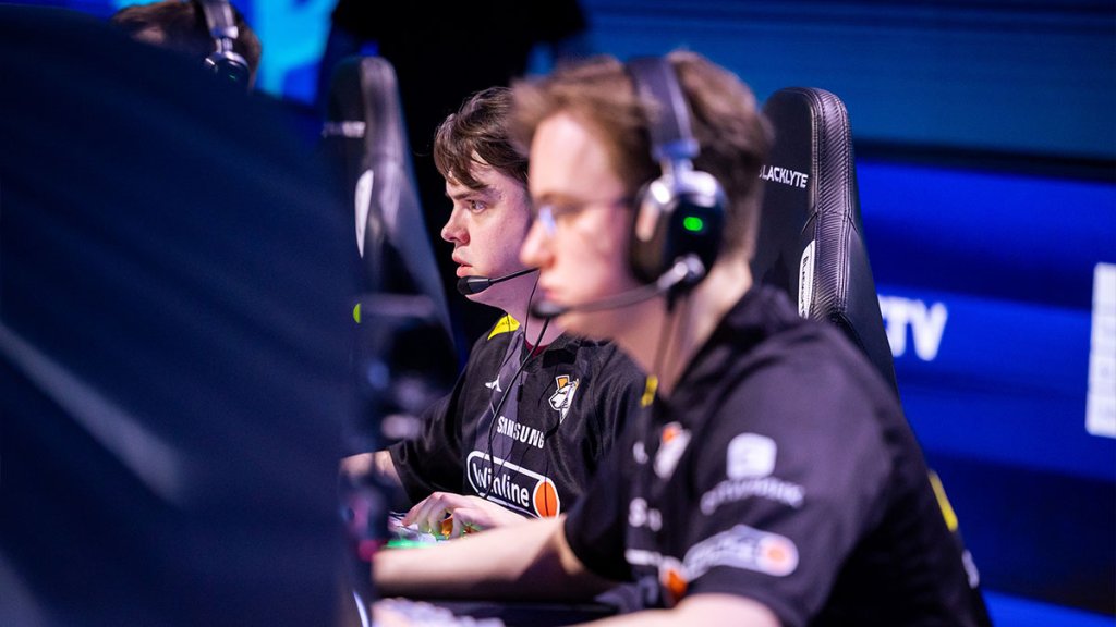 Esports players focused on a Counter-Strike match at a gaming event