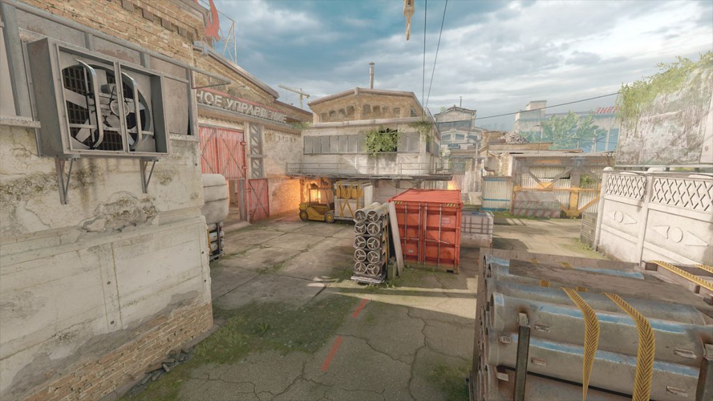 Counter-Strike map featuring industrial setting with warehouses and containers