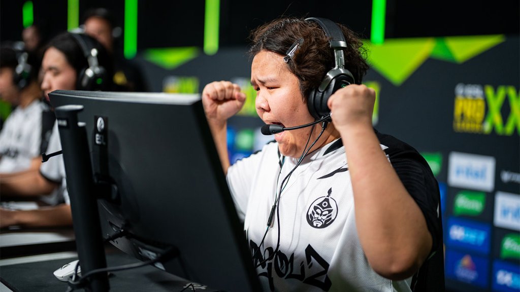 Esports player celebrating during a Counter-Strike match at a gaming tournament