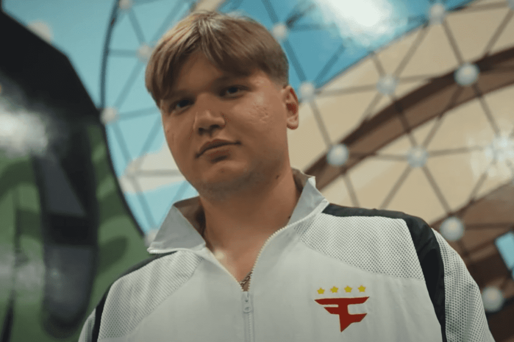 Esports player wearing a team FaZe jacket at a gaming event.
