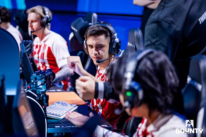 Esports team discussing strategy at a gaming tournament