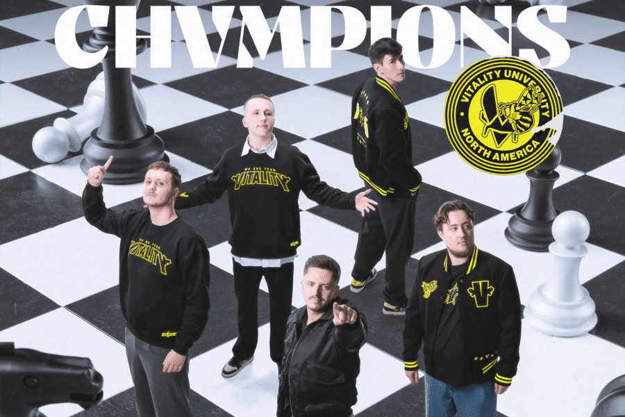 Esports team Vitality celebrates on a giant chessboard with 'CHAMPIONS' above and team crest.