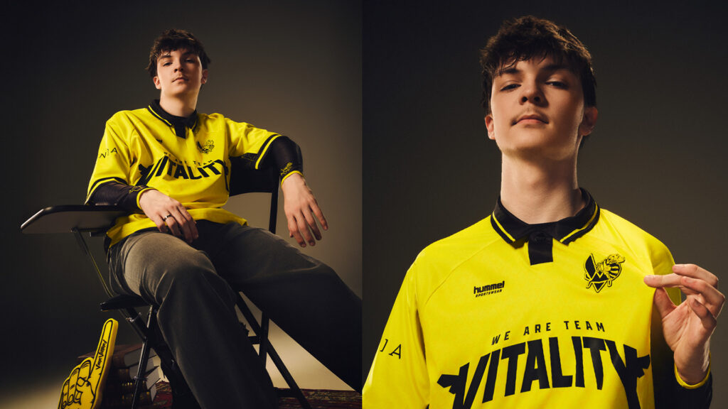 Esports player in a yellow Team Vitality jersey posing confidently.