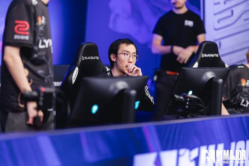 Esports players focused on a match at a gaming tournament stage.