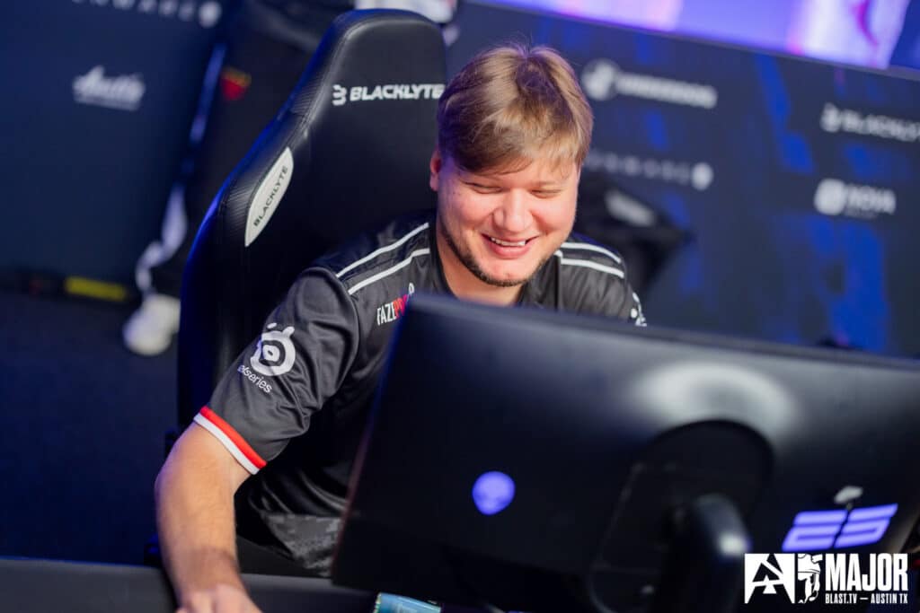 Smiling esports player during a Counter-Strike tournament at a gaming event.