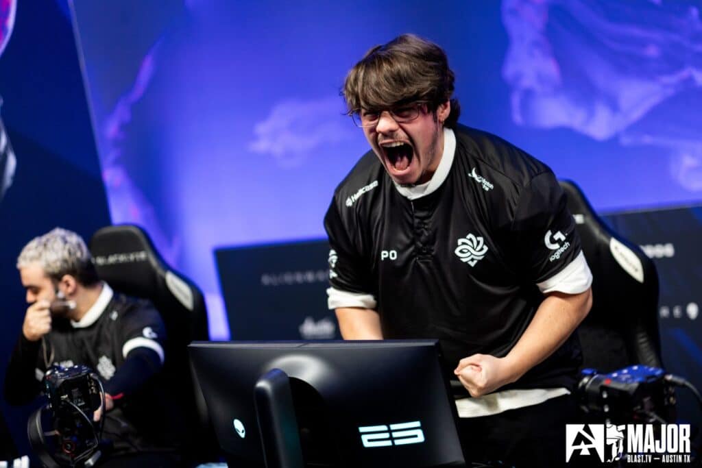 Excited esports player celebrating during a Counter-Strike tournament at the BLAST Major event.