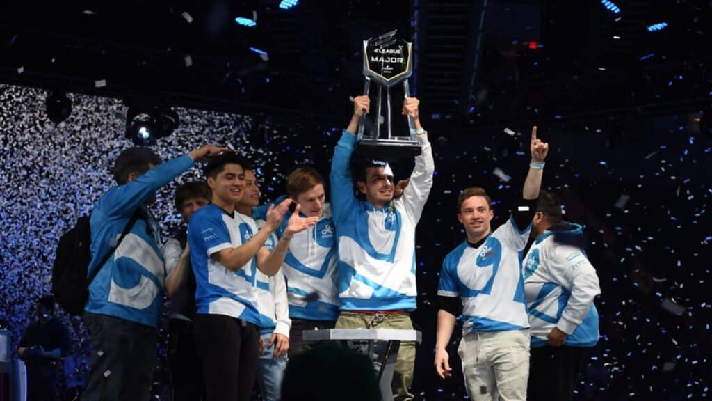 Esports team celebrating victory at ELeague Major with trophy