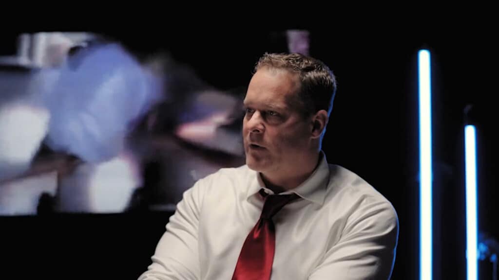 Focused esports commentator analyzing a gaming match with a futuristic backdrop