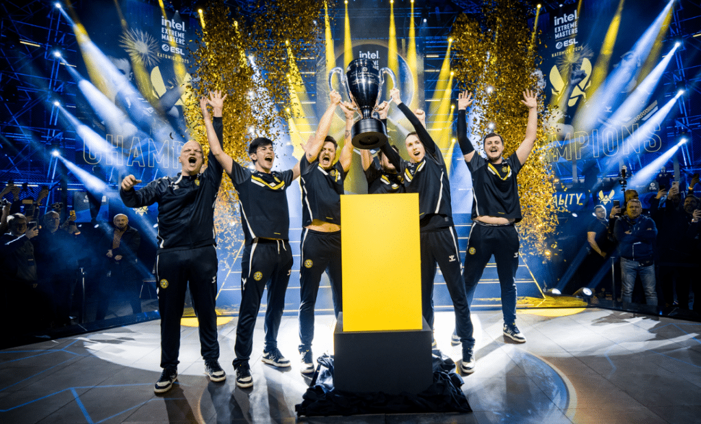 Esports team celebrating with trophy at Intel Extreme Masters event
