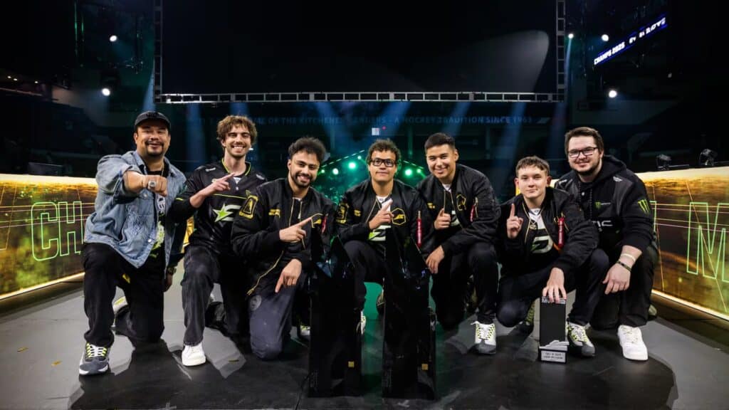Esports team celebrating victory at a Counter-Strike tournament stage