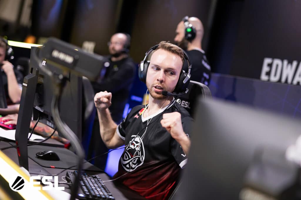 Esports player intensely focused during a Counter-Strike tournament at ESL event.