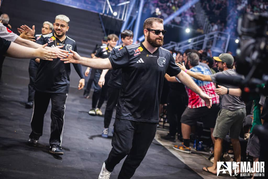 Esports team members high-fiving fans at a Counter-Strike tournament