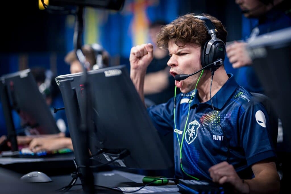 Excited esports player celebrating victory at a gaming tournament